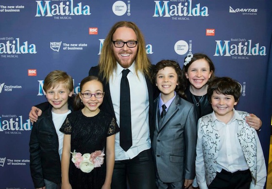 Multiple red carpet smiles